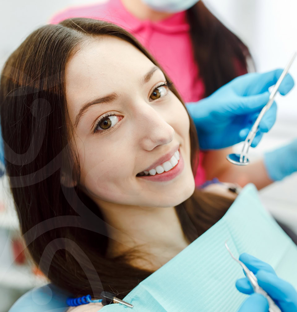 Happy patient showing white smile during procedure